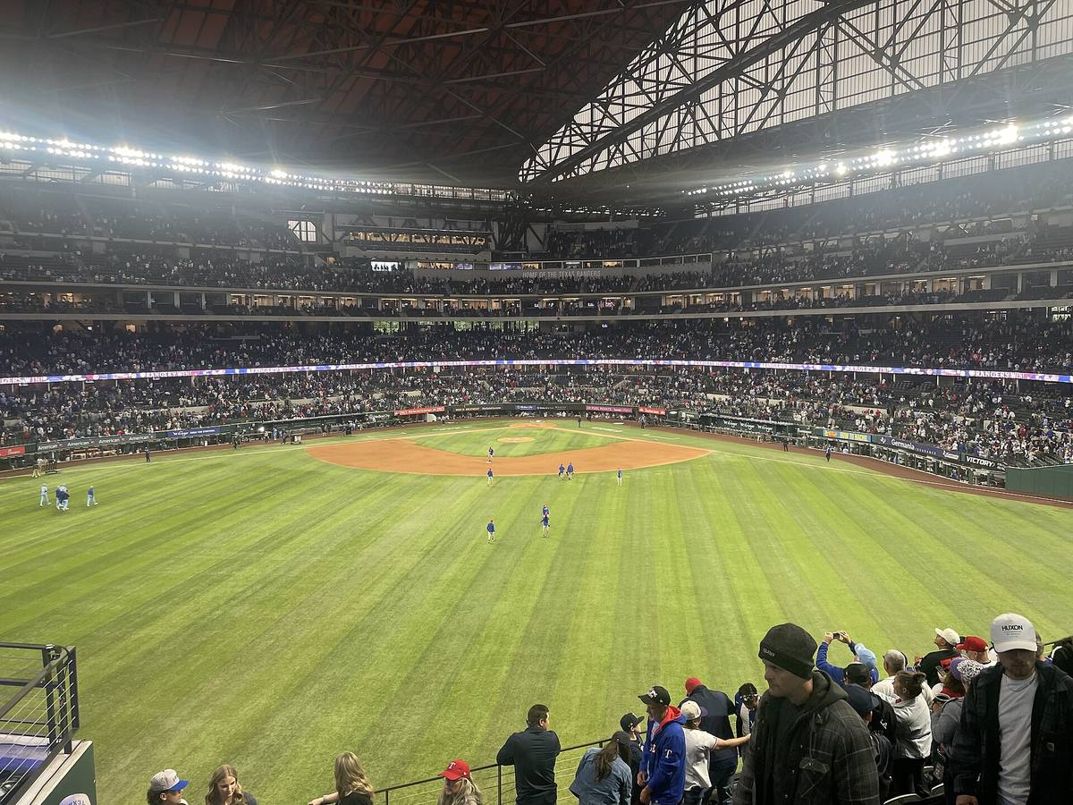 Globe Life Field in Arlington viewed from center field, used to illustrate a model of whether MLB run totals on the same date move together